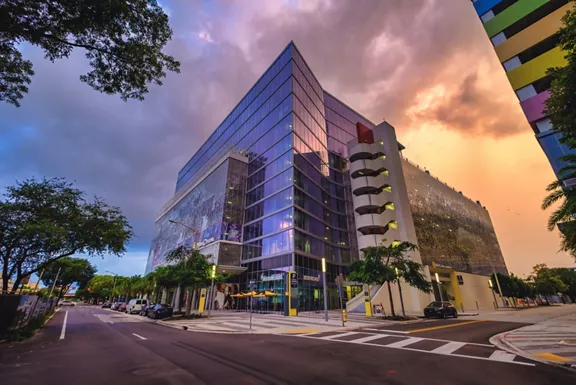 Exterior street-level view of the Brightline parking garage building in Miami.
