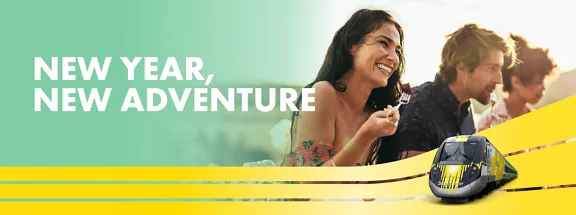3 people eating on right side of image with New Year, New Adventure copy above a train