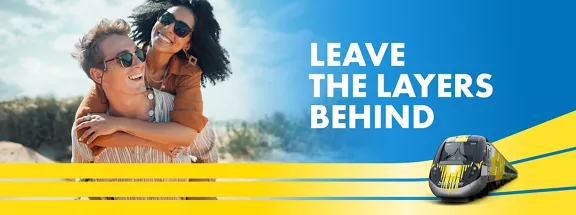 couple in sunglasses next to image of train and words Leave the layers behind