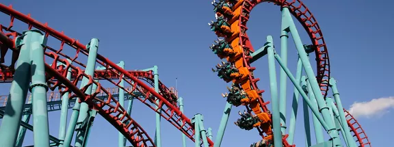 Red roller coaster and big blue sky