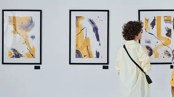 A couple staring and discussing an art display