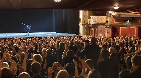 A crowd applauding the performance.