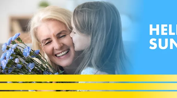 lady holding flowers gettinga kiss on the cheek from young girl with the words hello sunshine above a train image