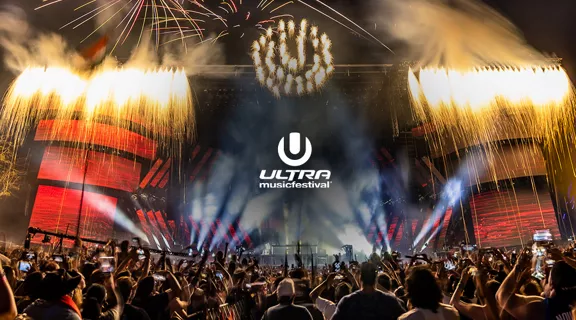Fans attending Ultra concert with stage and fireworks display
