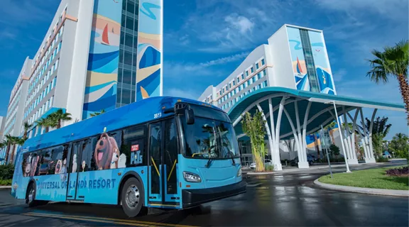 A Universal SuperStar shuttle sitting outside a resort.