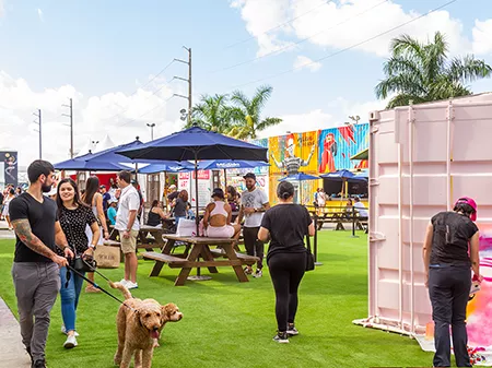 A group of people enjoying a stroll at a market