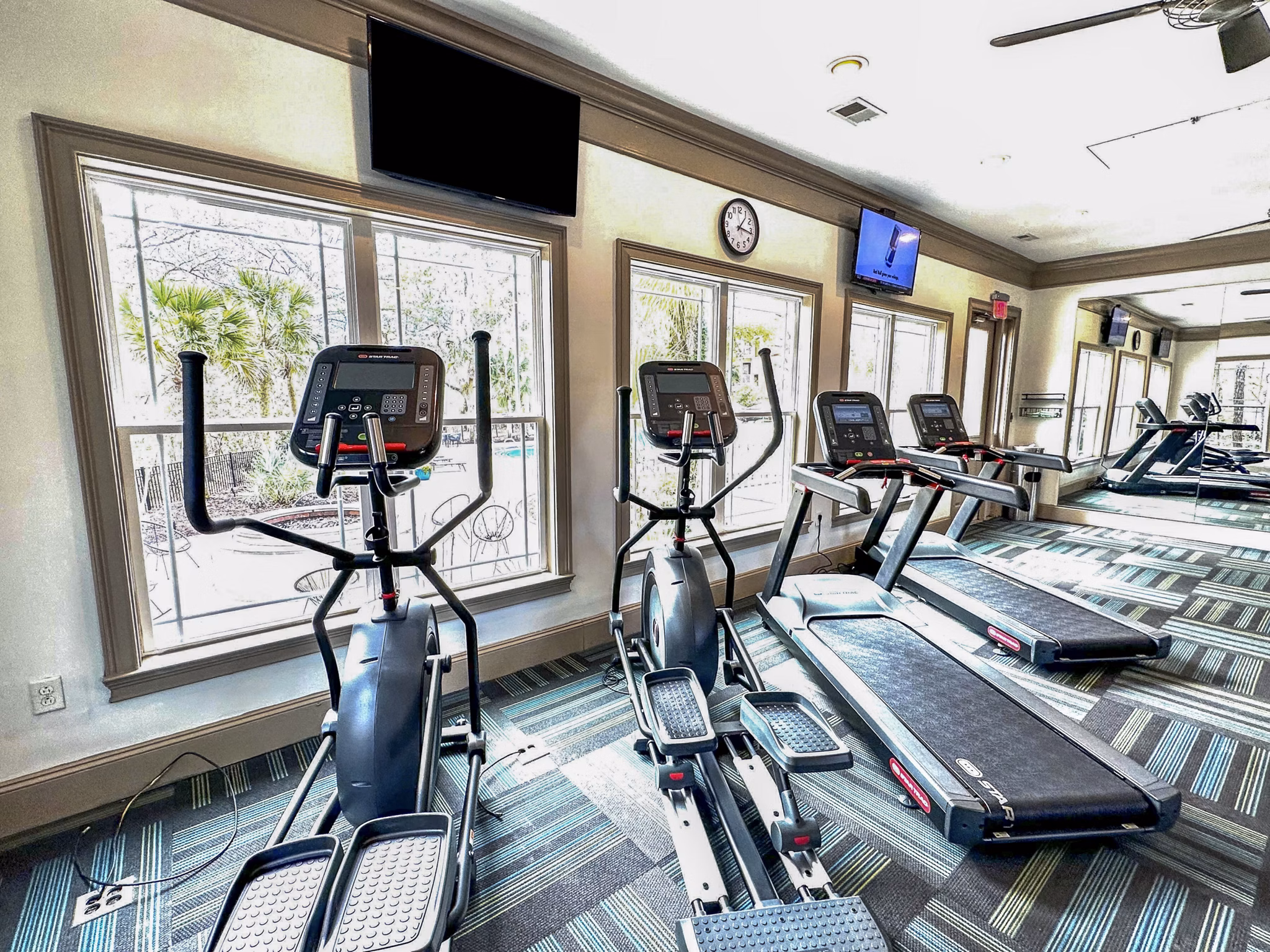 Modern fitness center with state-of-the-art equipment at Avana Long Point Apartments