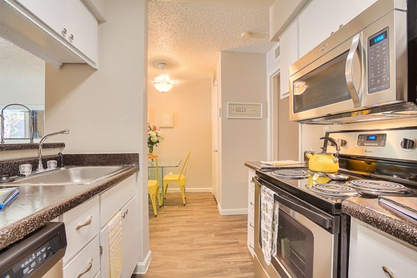 Modern kitchen with stainless steel appliances at Eagle Point Apartments