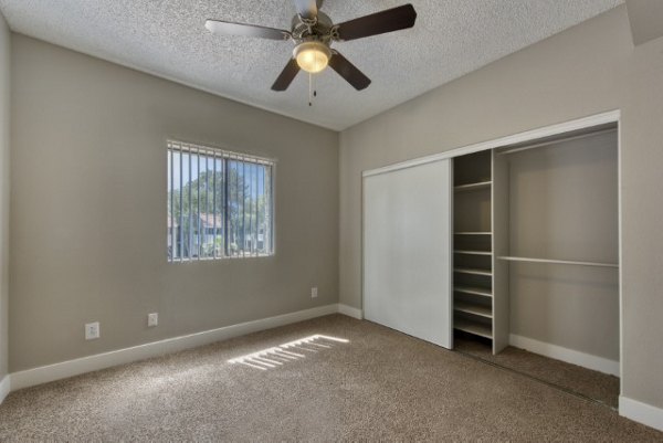 Cozy bedroom with modern decor at Avana Tempe Apartments, offering luxury living in Tempe