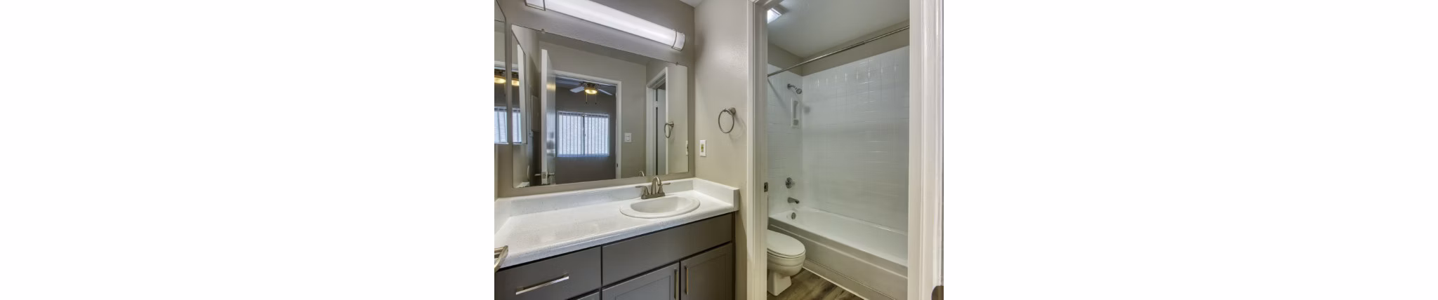 Elegant bathroom featuring modern fixtures and granite countertops at Avana Tempe Apartments
