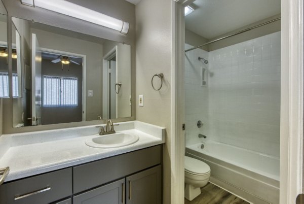 Elegant bathroom featuring modern fixtures and granite countertops at Avana Tempe Apartments