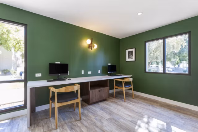 Modern business center with workstations and conference facilities at Avana Tempe Apartments