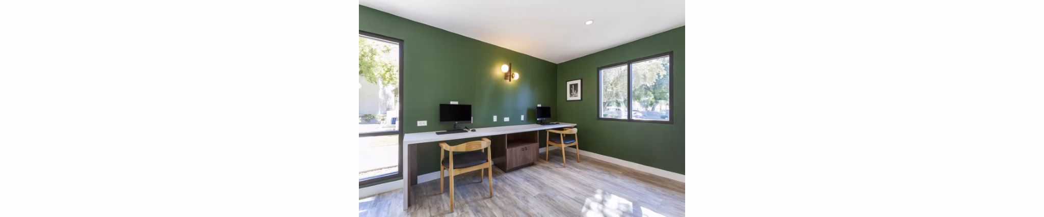 Modern business center with workstations and conference facilities at Avana Tempe Apartments