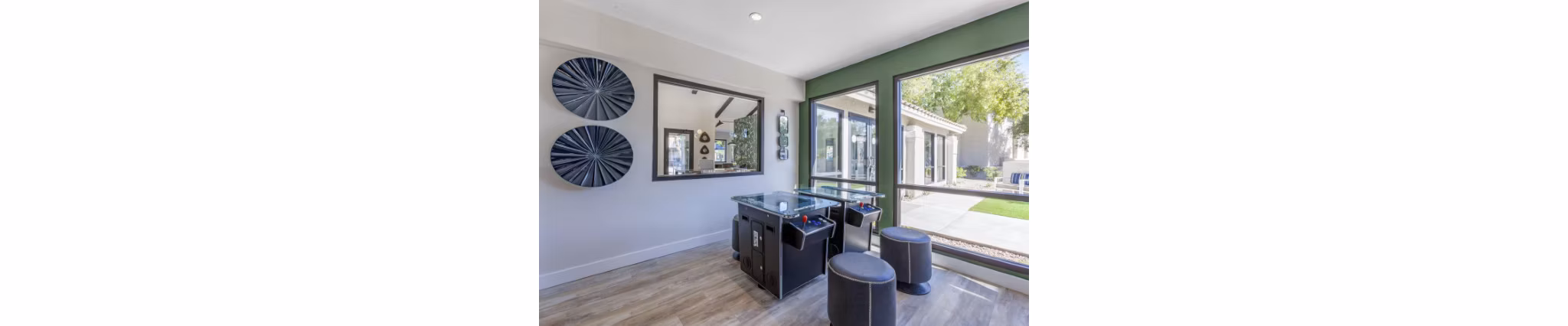Game room featuring pool tables and plush seating at Avana Tempe Apartments