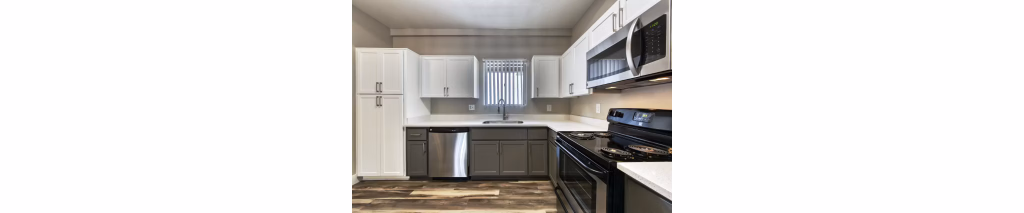Contemporary kitchen with stainless steel appliances at Avana Tempe Apartments