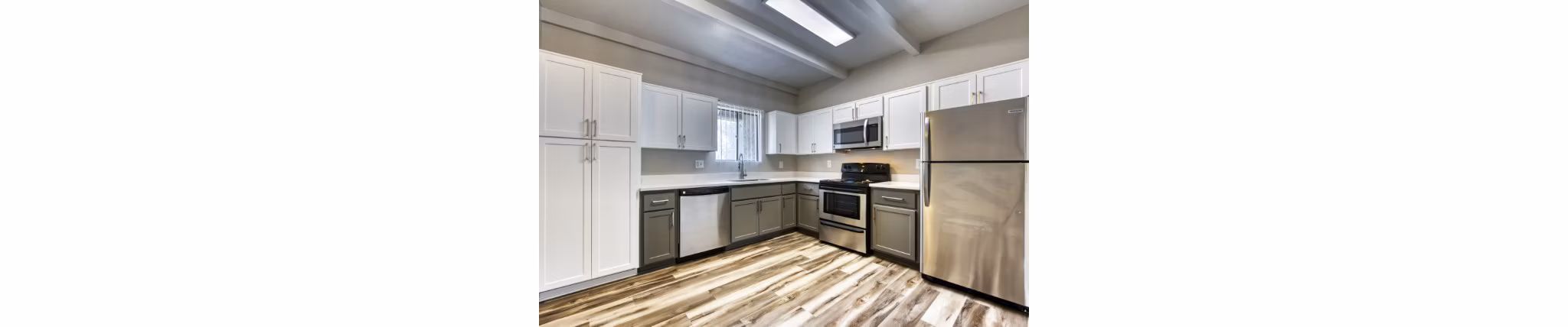 Spacious kitchen with modern appliances and granite countertops at Avana Tempe Apartments