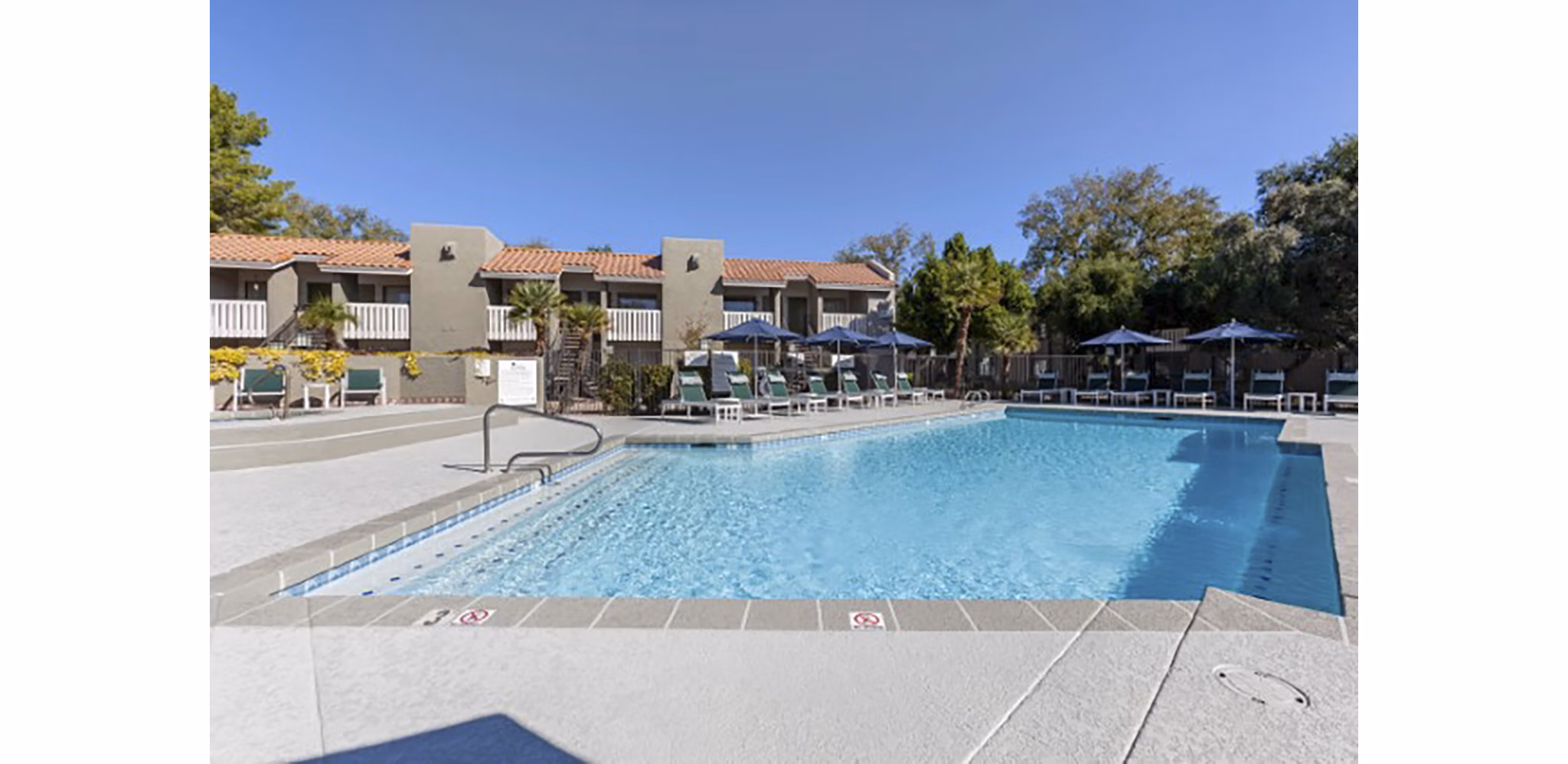 Resort-style pool with lounge seating at Avana Tempe Apartments, offering luxury living in a vibrant community setting