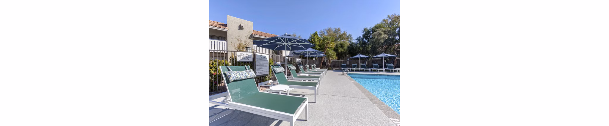 Resort-style pool area with lounge seating at Avana Tempe Apartments, offering luxury living amenities