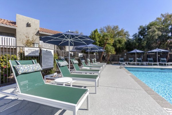 Resort-style pool area with lounge seating at Avana Tempe Apartments, offering luxury living amenities