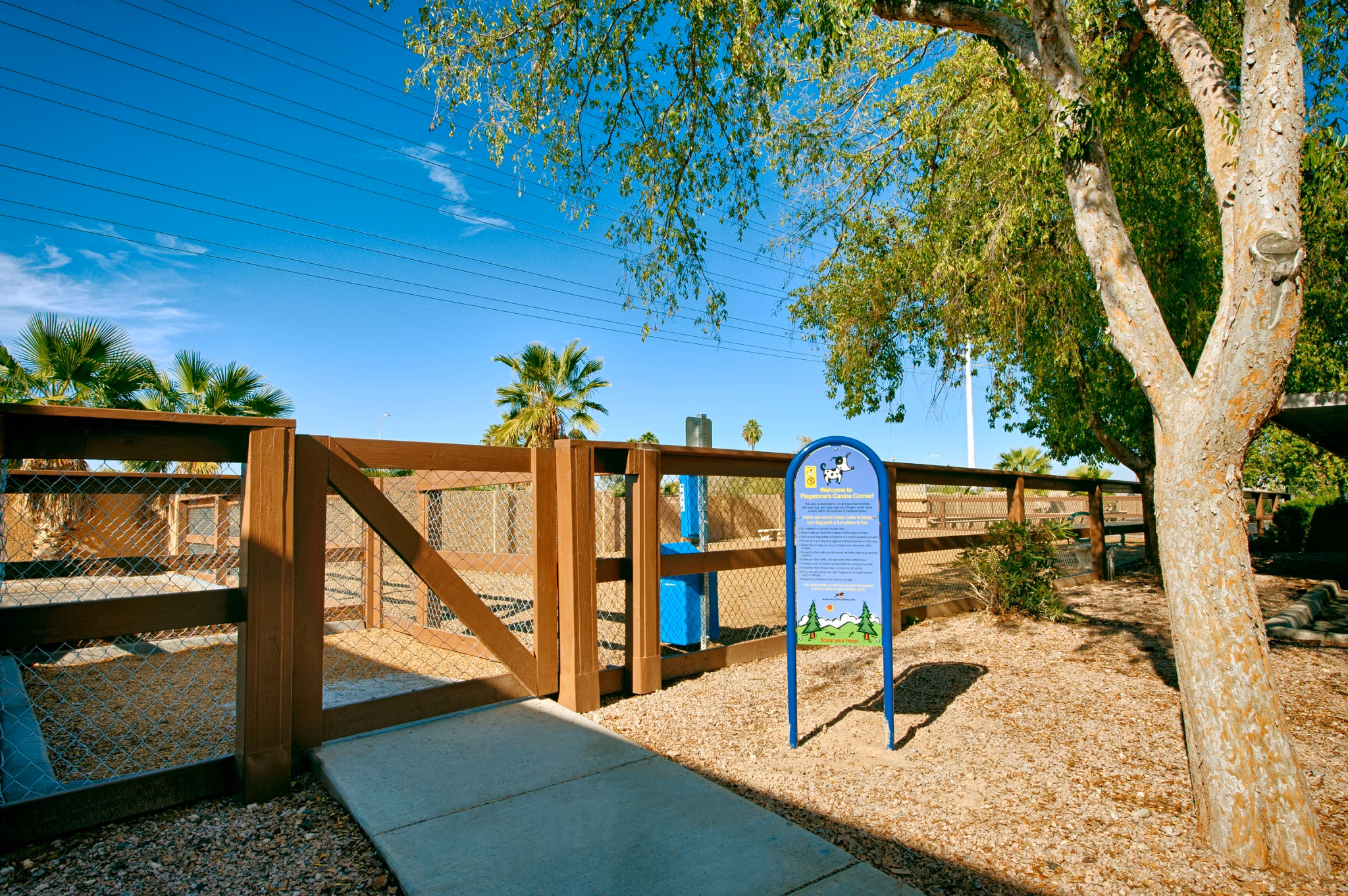 Dog park with agility equipment at Flagstone Apartments in luxury Greystar community