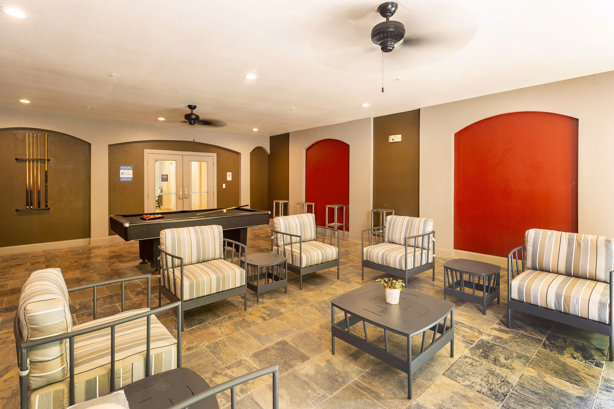 Clubhouse featuring modern design and seating at Boardwalk at Town Center Apartments
