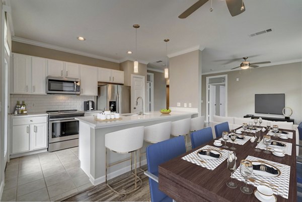 Dining area with modern decor and ample seating at Boardwalk at Town Center Apartments, showcasing luxury living spaces