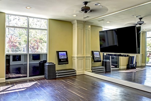 State-of-the-art fitness center at Boardwalk at Town Center Apartments offering modern equipment and spacious workout area