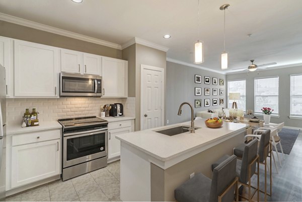 Modern kitchen with stainless steel appliances at Boardwalk at Town Center Apartments Perfect for luxury living and gourmet cooking