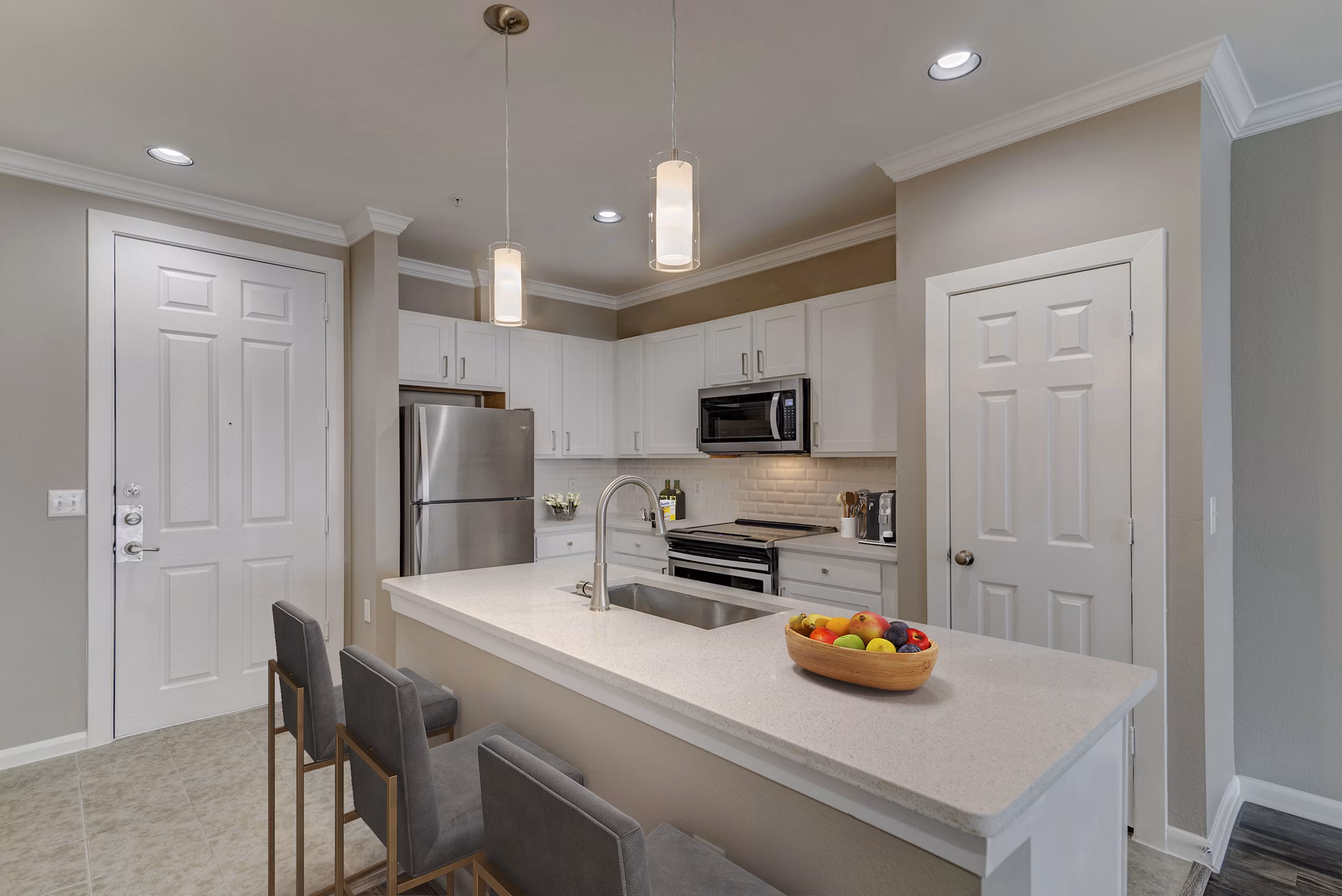 Modern kitchen with stainless steel appliances in Boardwalk at Town Center Apartments