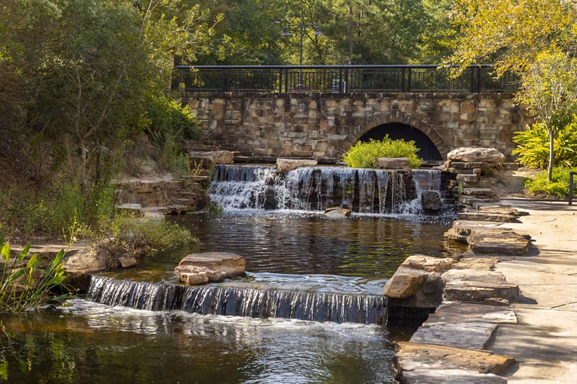 Neighborhood park near Boardwalk at Town Center Apartments with walking paths and green spaces, ideal for outdoor activities and relaxation