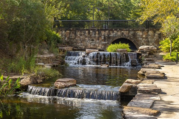 Neighborhood park near Boardwalk at Town Center Apartments with walking paths and green spaces, ideal for outdoor activities and relaxation