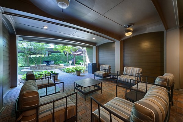 Boardwalk at Town Center: Stylish patio with seating and greenery at luxury apartments