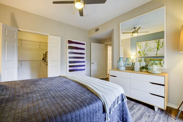 Spacious bedroom with modern decor at The Preserve at Travis Creek Apartments