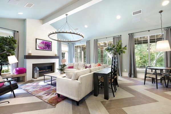 Chic clubhouse with contemporary furniture at The Preserve at Travis Creek Apartments for social events and gatherings