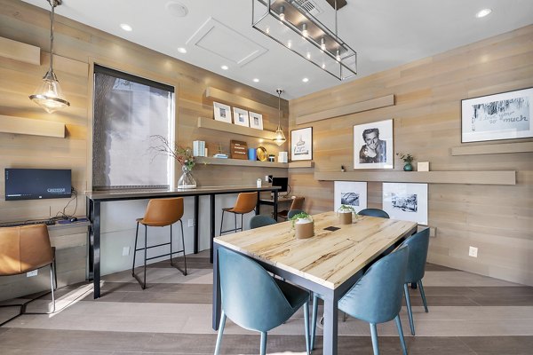 Modern clubhouse with lounge seating at The Preserve at Travis Creek Apartments