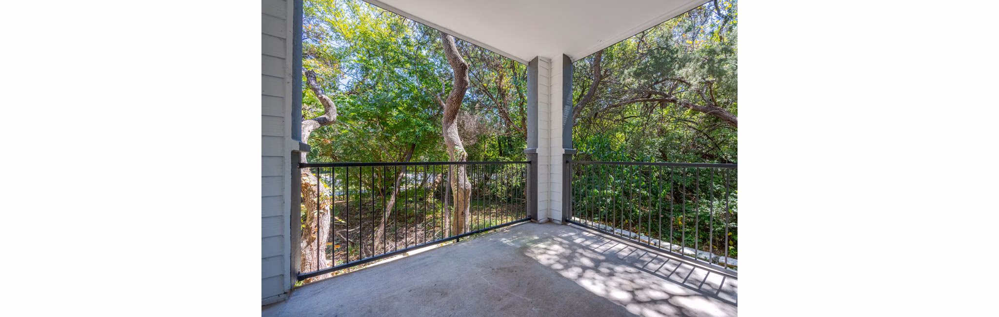 Spacious outdoor patio with stylish seating at The Preserve at Travis Creek Apartments, perfect for relaxation and entertaining