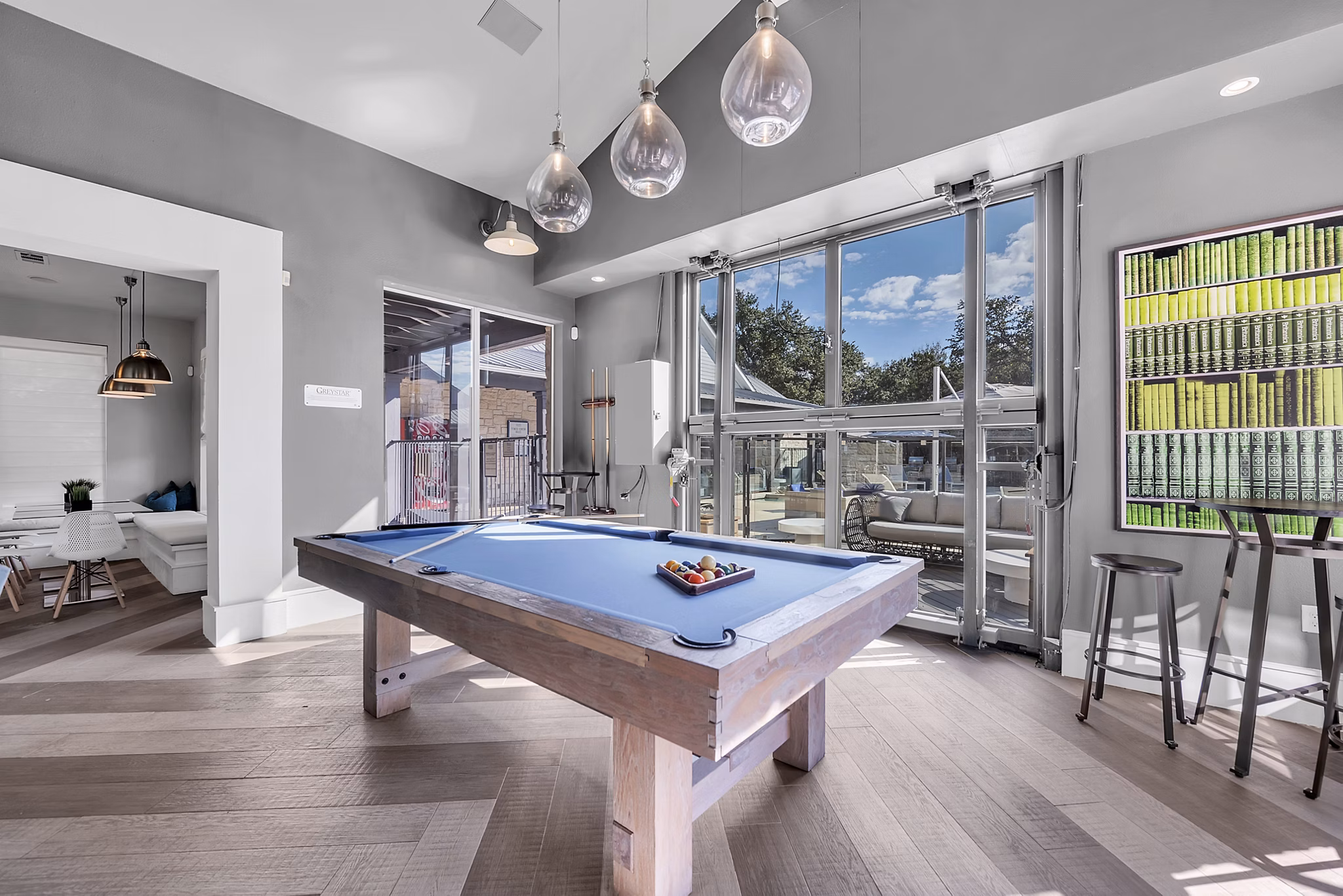 Game room with billiards and seating area at The Preserve at Travis Creek Apartments