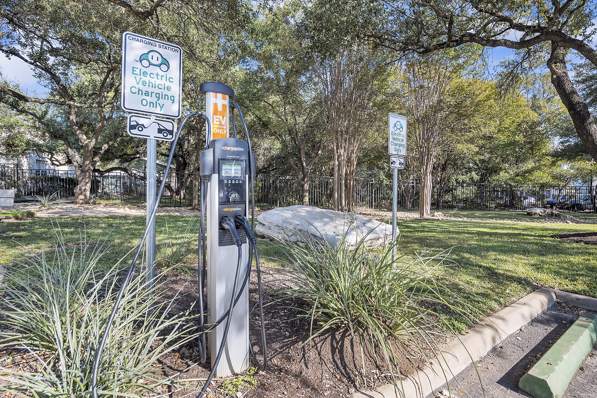 Eco-friendly car charging station at The Preserve at Travis Creek Apartments, enhancing sustainable living options for residents