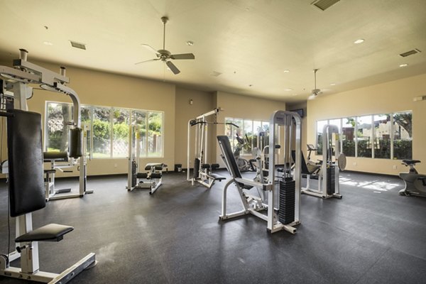 State-of-the-art fitness center with modern equipment at Odyssey Landing Apartments