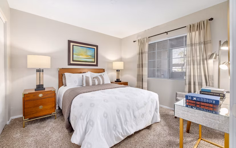 Cozy bedroom with modern decor at Destinations Alexander Apartments
