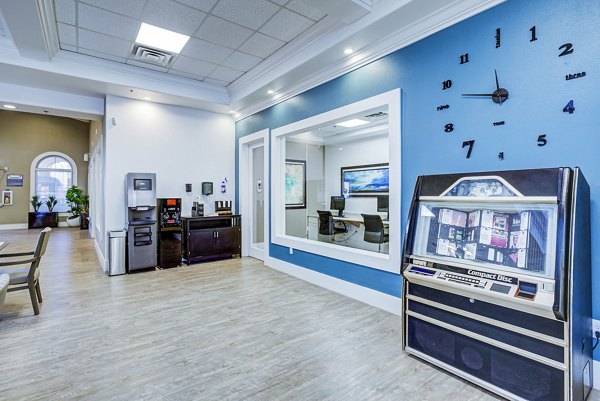 Clubhouse with modern design and comfortable seating at Destinations Alexander Apartments, a Greystar community in Las Vegas