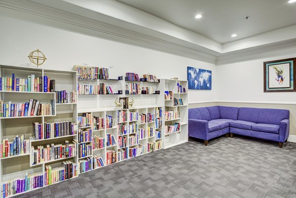 Clubhouse library with cozy reading nooks at Destinations Alexander Apartments
