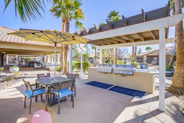 Outdoor grill area and patio at Destinations Alexander Apartments, perfect for entertaining and relaxation