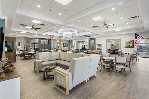 Modern clubhouse with stylish seating and pool table at Destinations Pebble Apartments