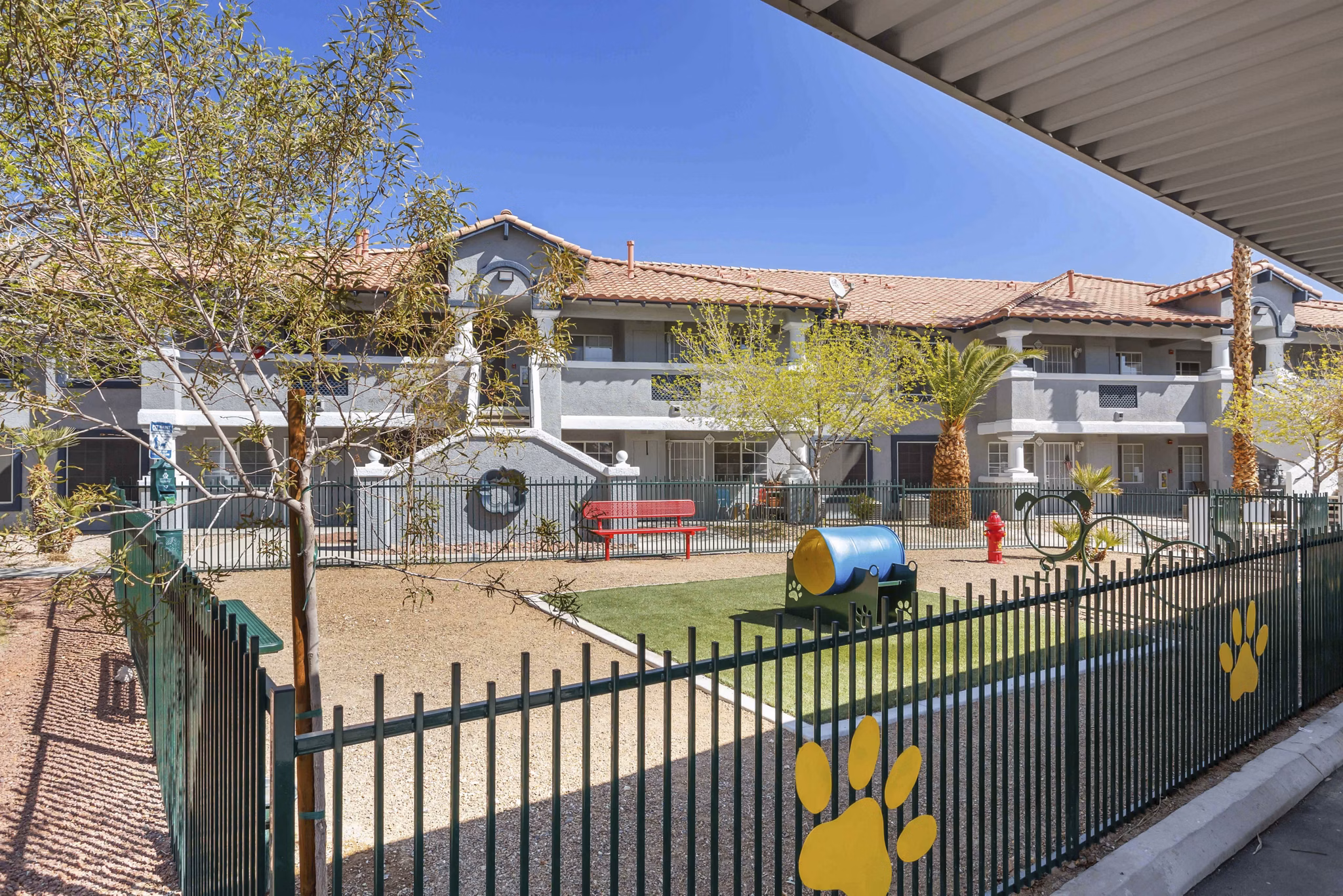 Off-leash dog park with agility course at Destinations Pebble Apartments, ideal for pet-friendly living options