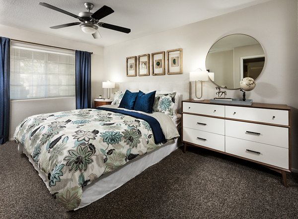 Cozy bedroom with modern decor at Destinations Pueblo Apartment Homes, luxury living with Greystar quality