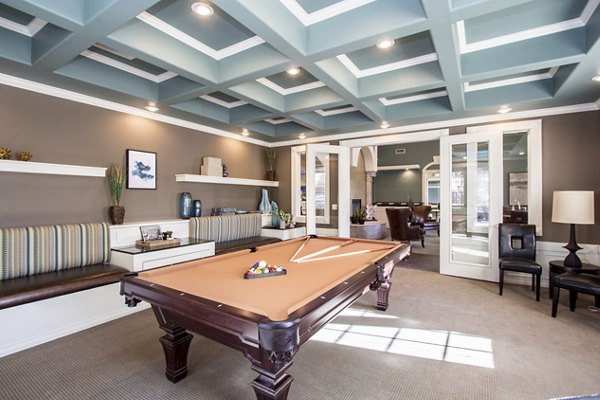 Game room with pool table and seating at Destinations Pueblo Apartments