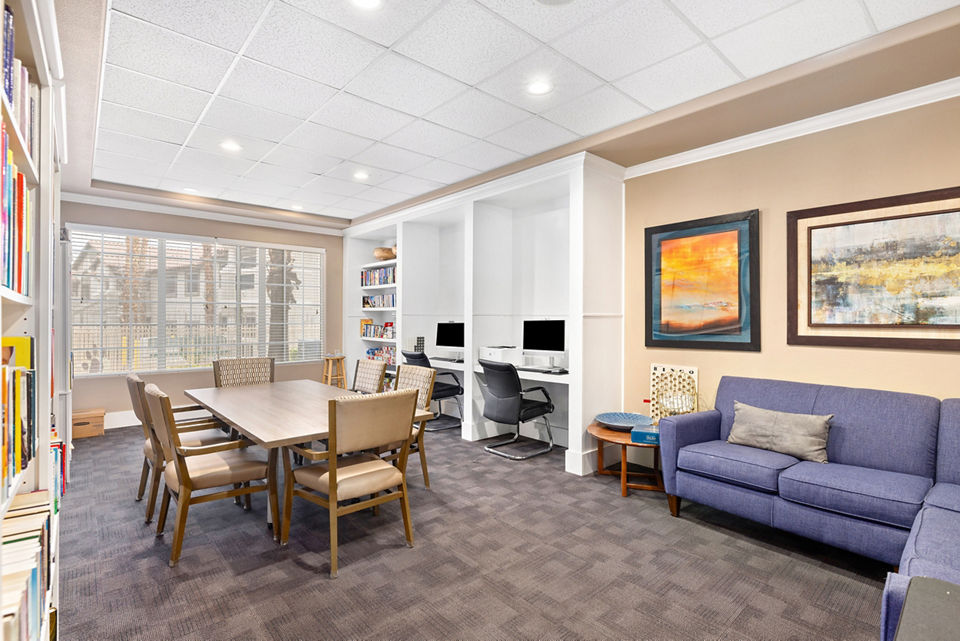 Game room with pool table and seating at Destinations Pueblo Apartments