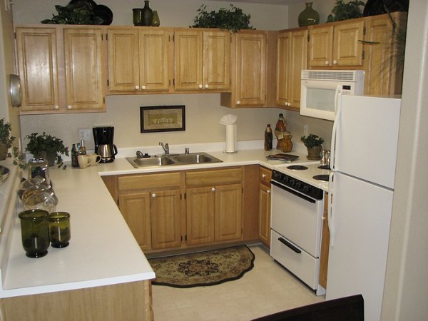 Luxe kitchen with granite countertops and stainless steel appliances at Destinations Pueblo Apartments, ideal for modern culinary enthusiasts