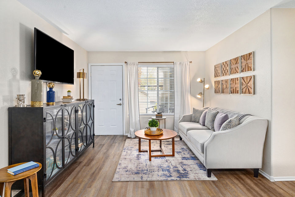 Spacious living room with modern decor in Destinations Pueblo Apartments